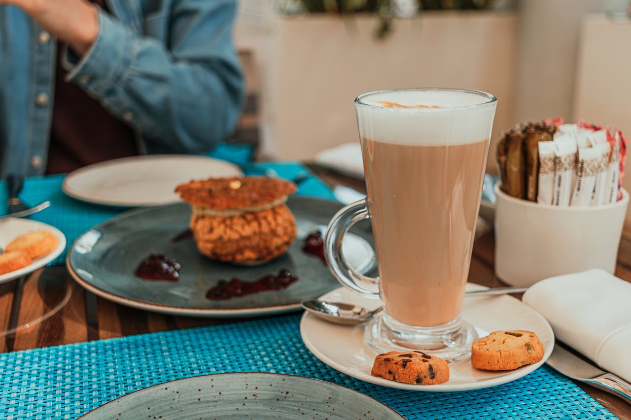 gallery-6 Enjoy a cozy cafe brunch in Dubai with a frothy latte and delicious pastries.
